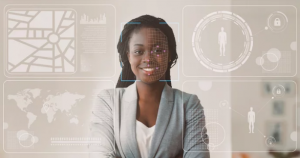 Woman standing and smiling while the system is doing a facial recognition of her