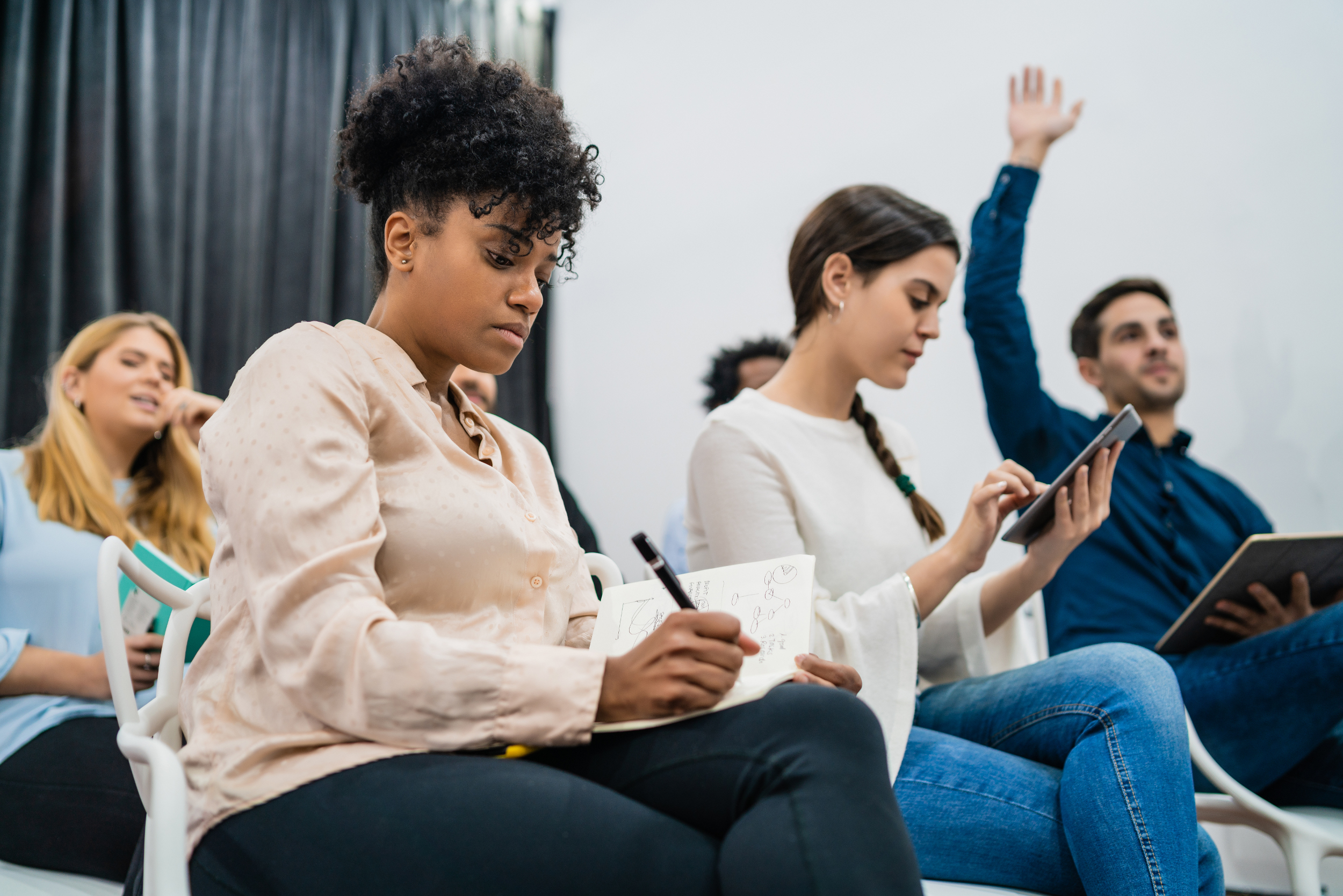 Group of people sitting together in a GoodX work training programme