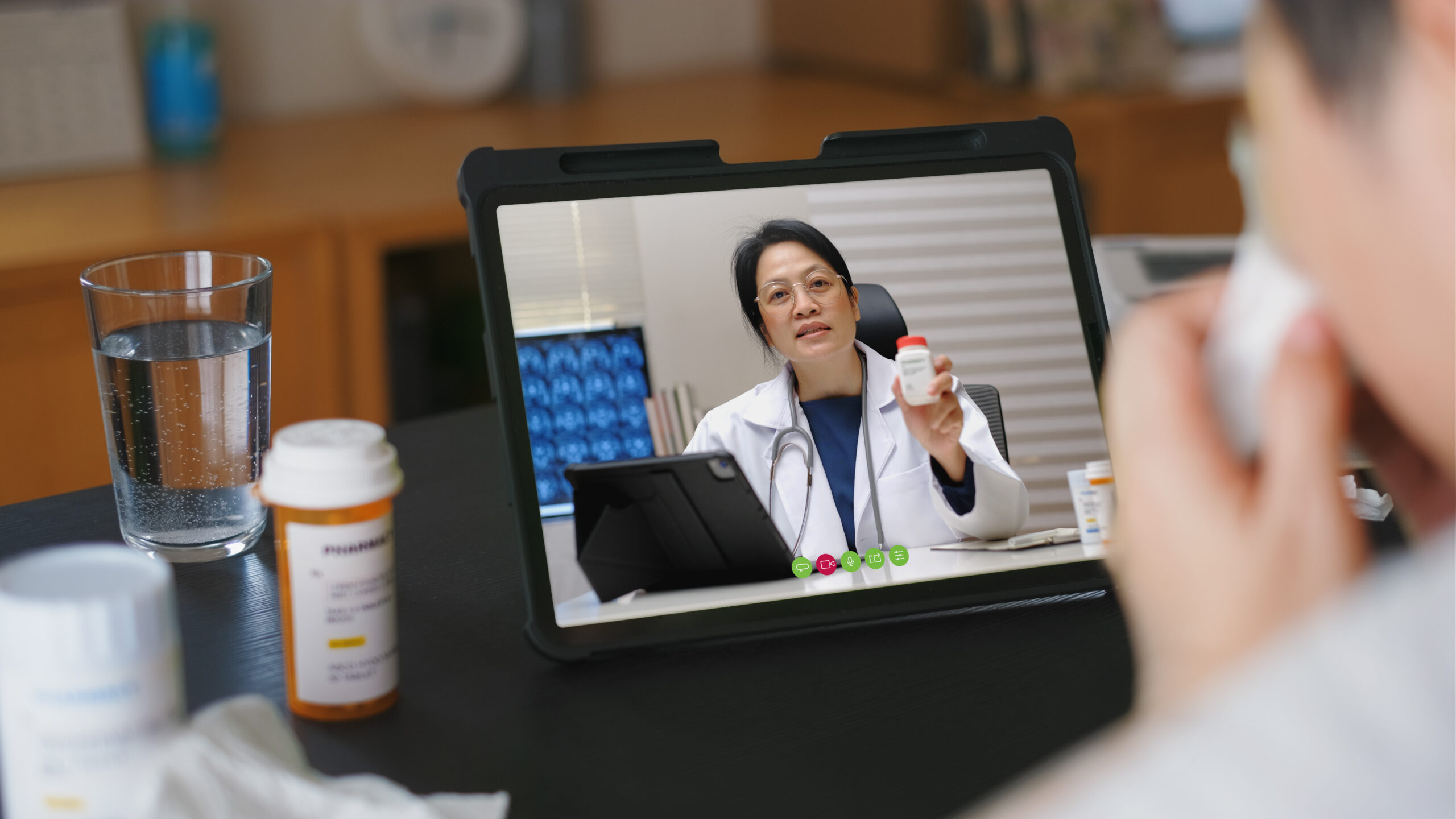 Telehealth concept,asian woman video call with her doctor Doctor doing a telemed consultation with a patient over a tablet.