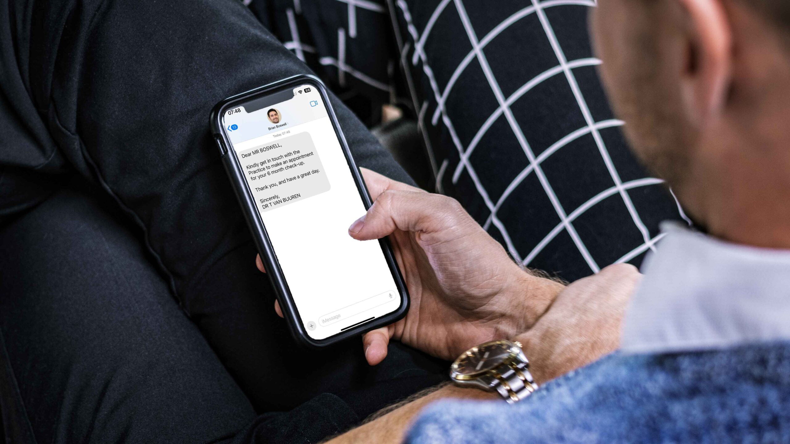 Closeup businessman using mobile phone