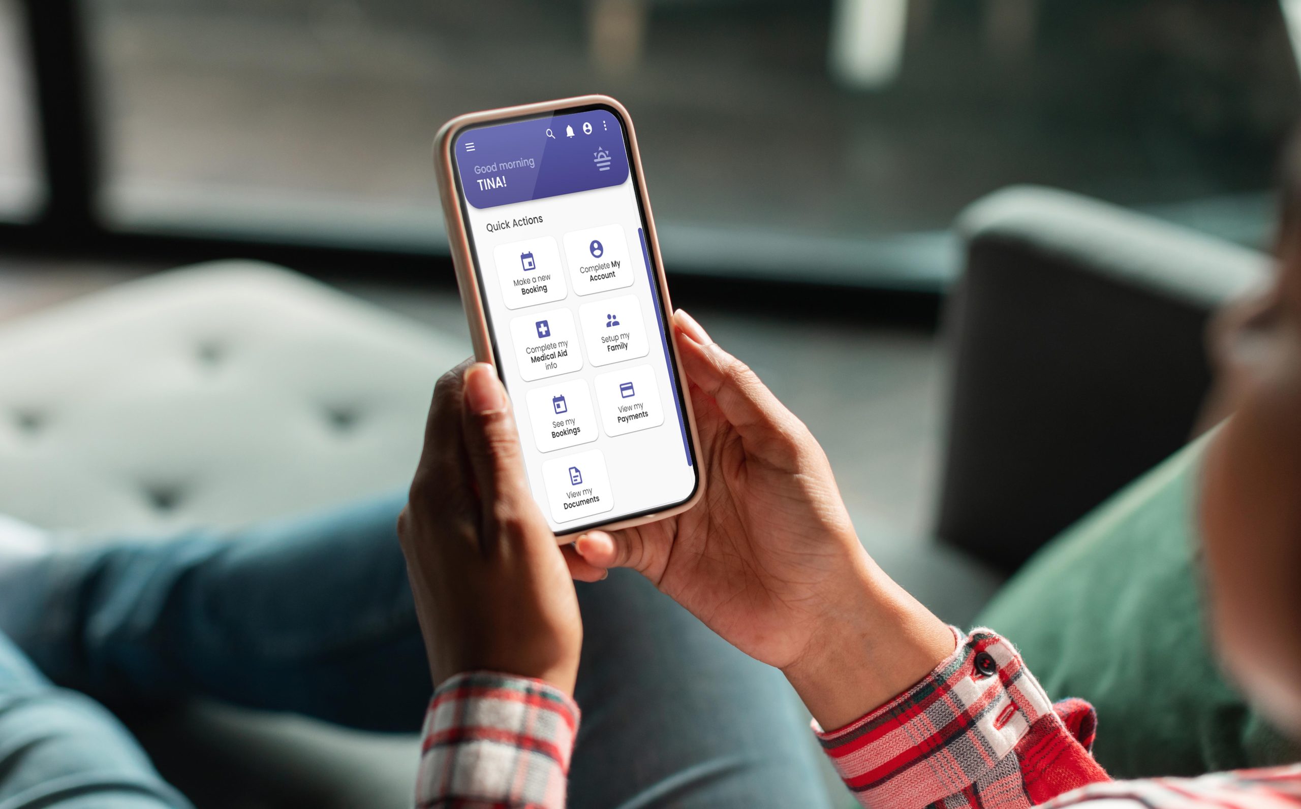 Unrecognizable woman browsing healthcare app on her smartphone at home Unrecognisable person looking at their phone, which displays the MyGC app
