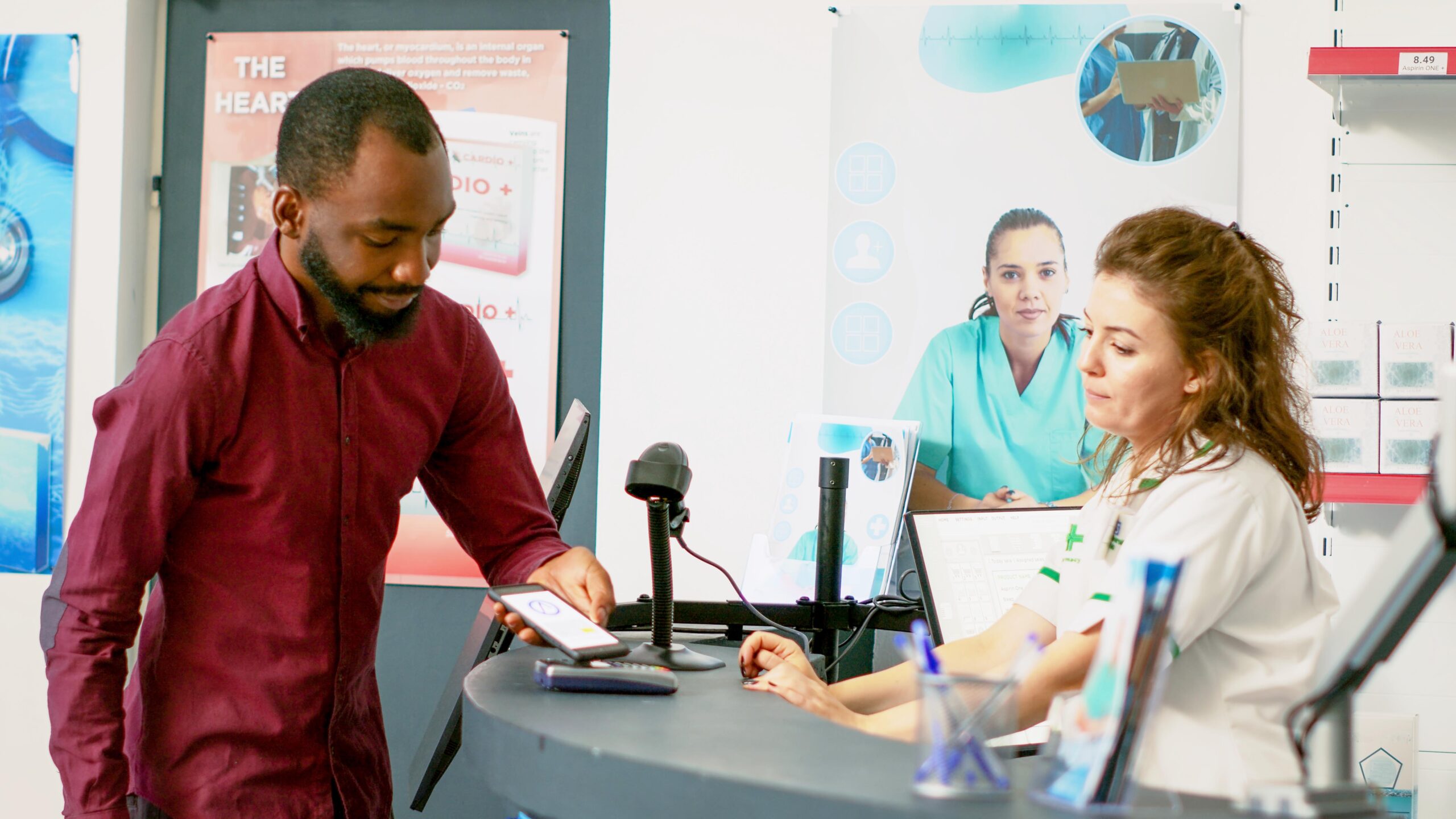 Young adult paying for treatment with mobile phone nfc on pos terminal Young adult paying for treatment with mobile phone nfc on pos terminal